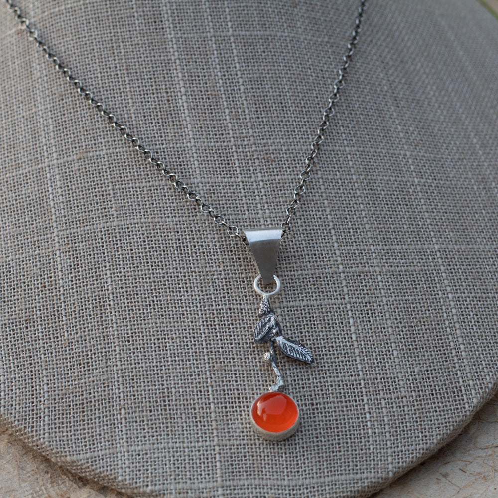 AAA-grade carnelian mandarin orange pendant necklace with textured sterling silver leaves on an 18-inch chain