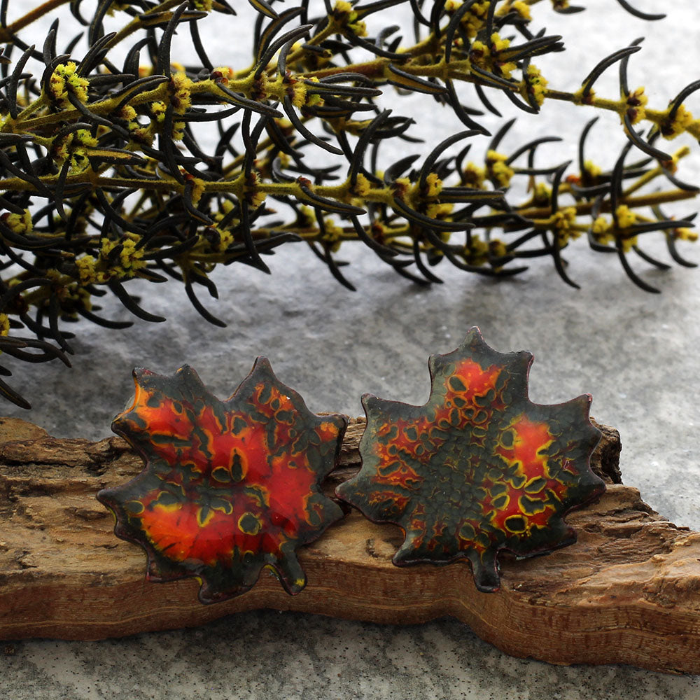 Enamel maple leaf stud earrings in assorted fall colors