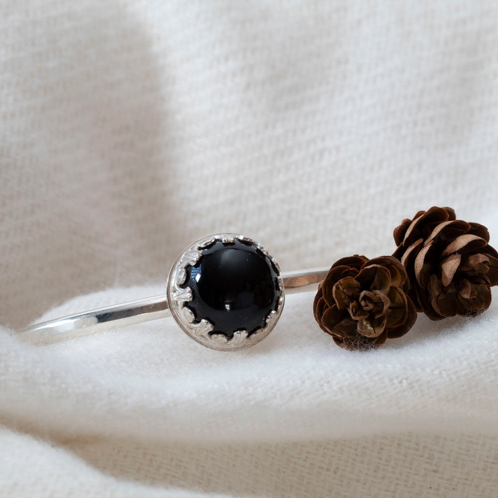 Sterling silver cuff bracelet with 14mm black onyx cabochon in gallery bezel, handcrafted in Vermont, 6-inch length with 1-inch gap.