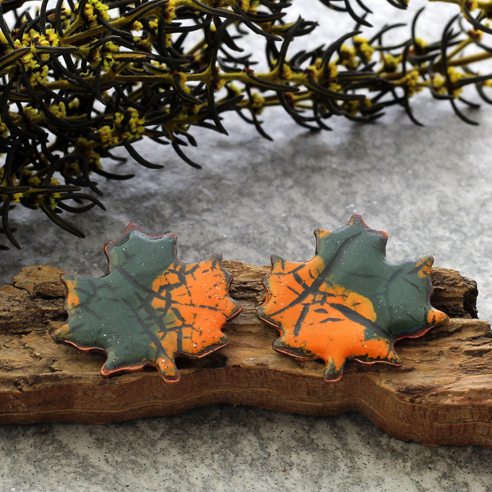 Enamel maple leaf stud earrings in assorted fall colors