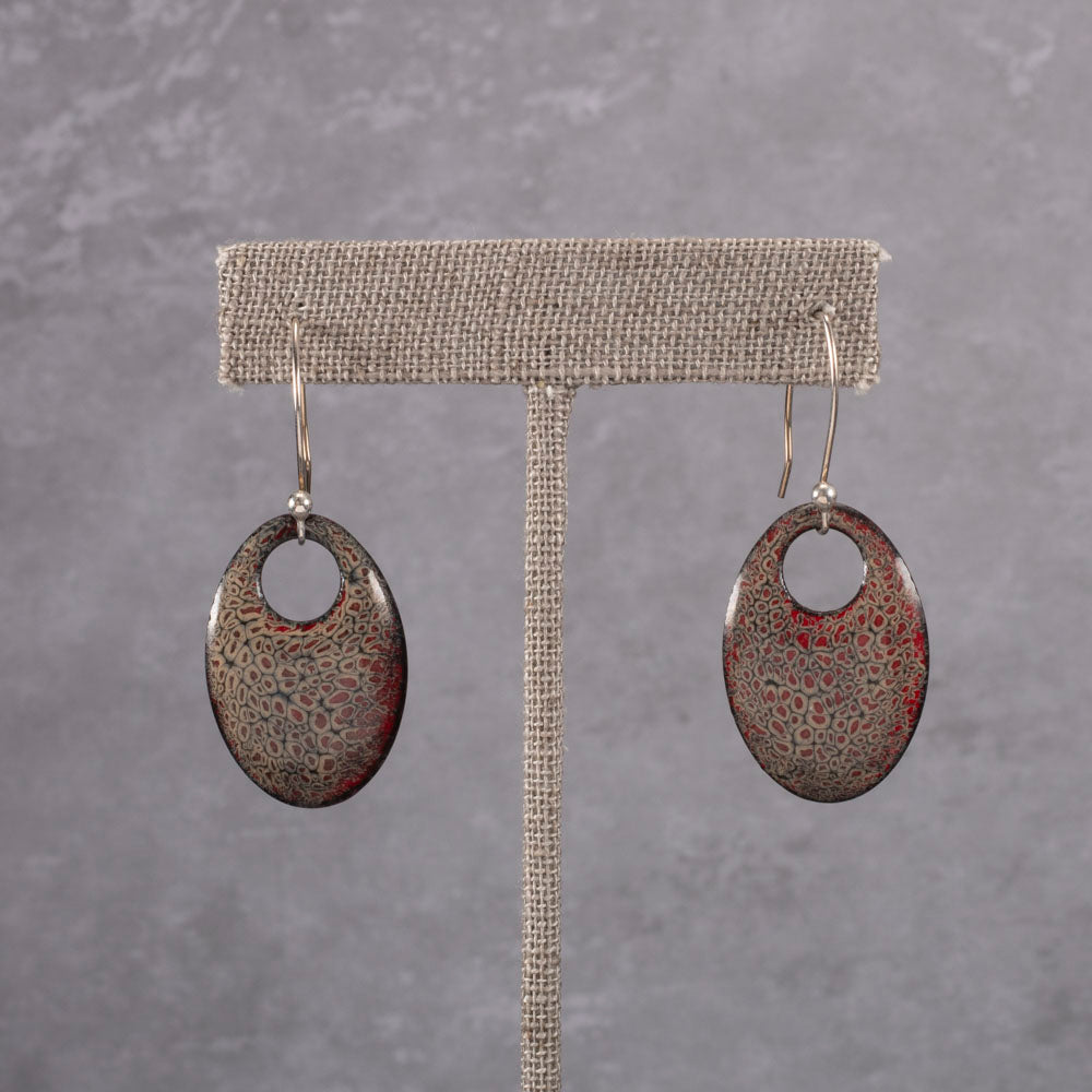 Handmade oval dangle earrings with red and gray kiln-fired enamel on copper and gold -filled ear wires.