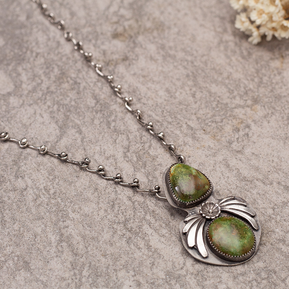 Handmade sterling silver necklace with Sonoran turquoise stones and handmade chain.