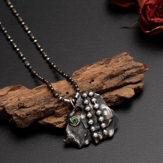 Sterling silver abstract pendant necklace with green cubic zirconia and beaded texture, handmade artisan jewelry on oxidized beaded chain, by Divella Designs.