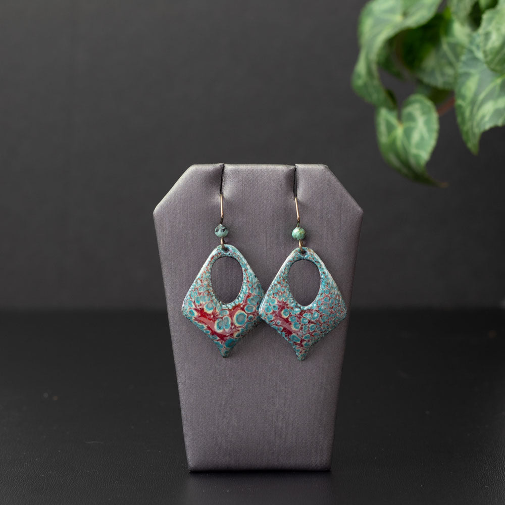 Diamond-shaped aqua and cranberry enamel earrings with open teardrop centers, handmade on copper with niobium ear wires and coordinating gemstone beads.