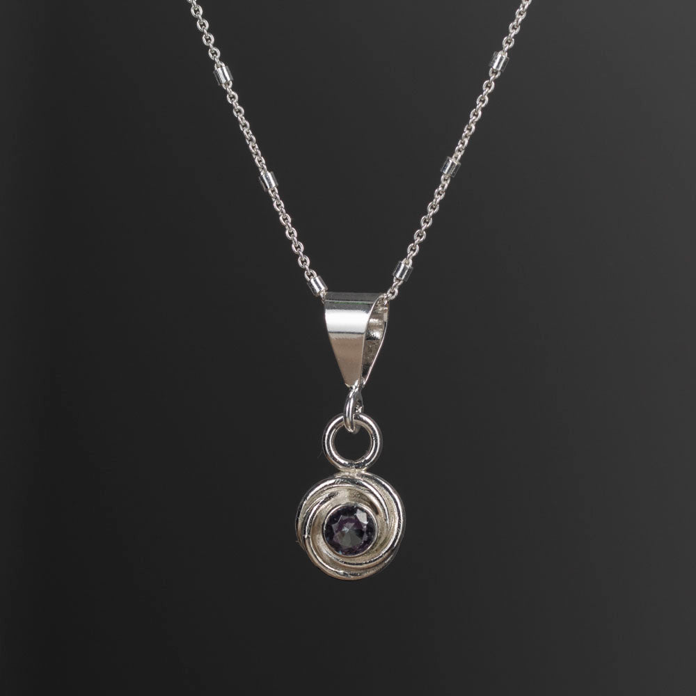 Sterling silver pendant necklace with simulated alexandrite that shifts from greenish-blue to deep violet, handmade in Vermont by Divella Designs.