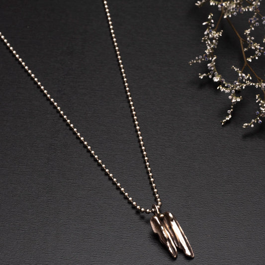 Handmade broom-cast sterling silver necklace created from recycled scrap silver, unique organic pendant on silver chain