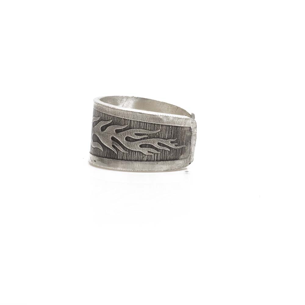 ear cuff with engraved flame motif and brushed finish