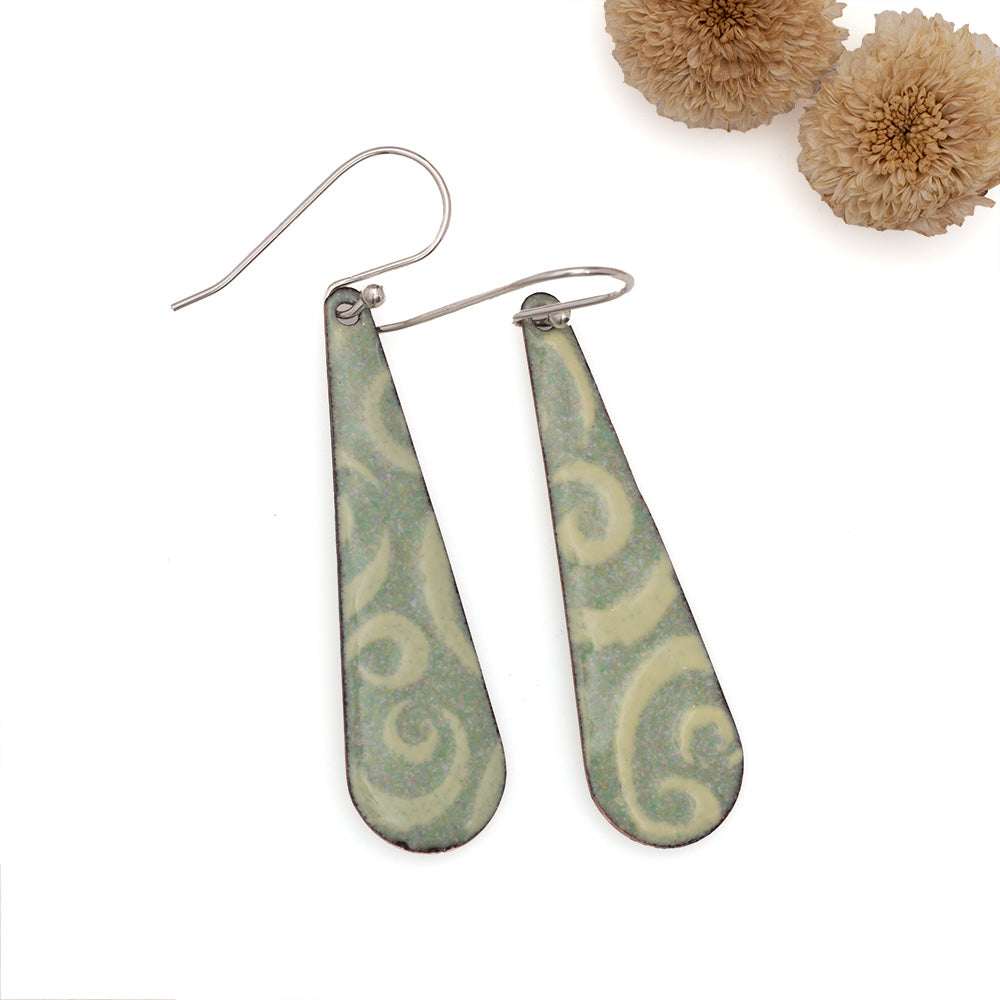 Pale green enamel dangle earrings with soft cream swirls and sterling silver ear wires