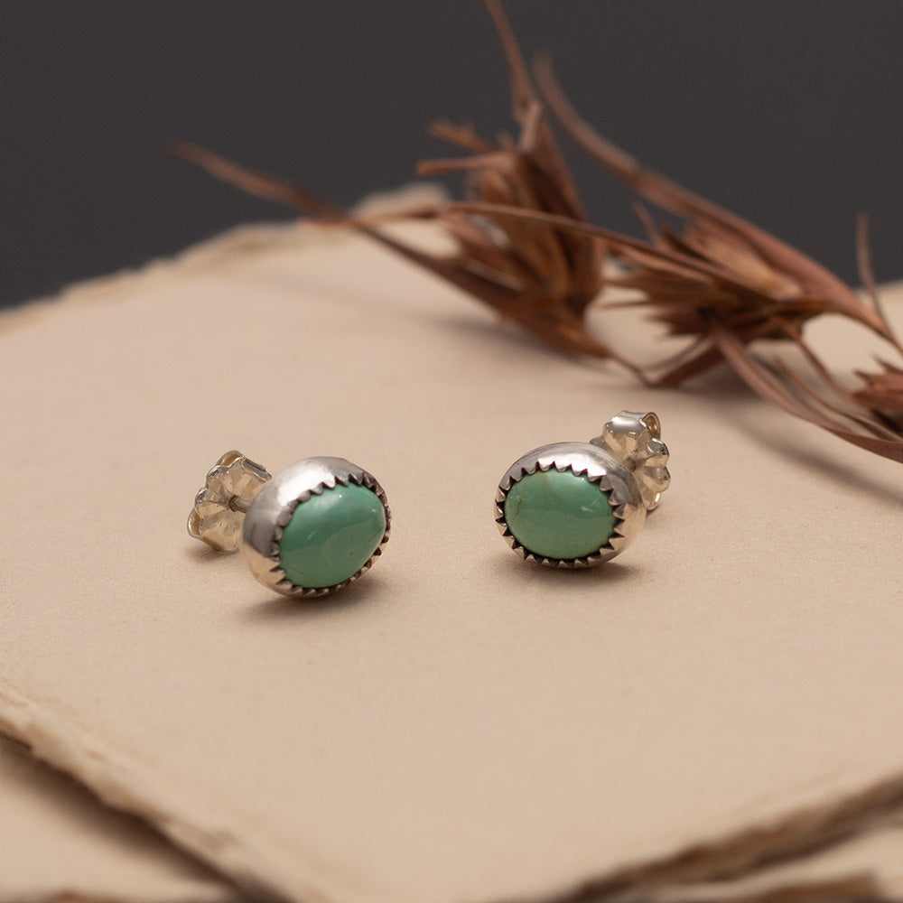 Sterling silver stud earrings with 11mm King’s Manassa turquoise stones.