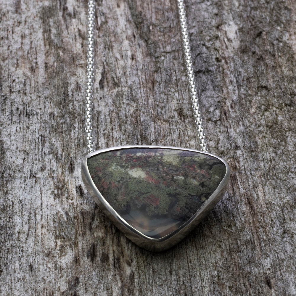 Sterling silver pendant with dendritic moss agate on 18 inch chain.