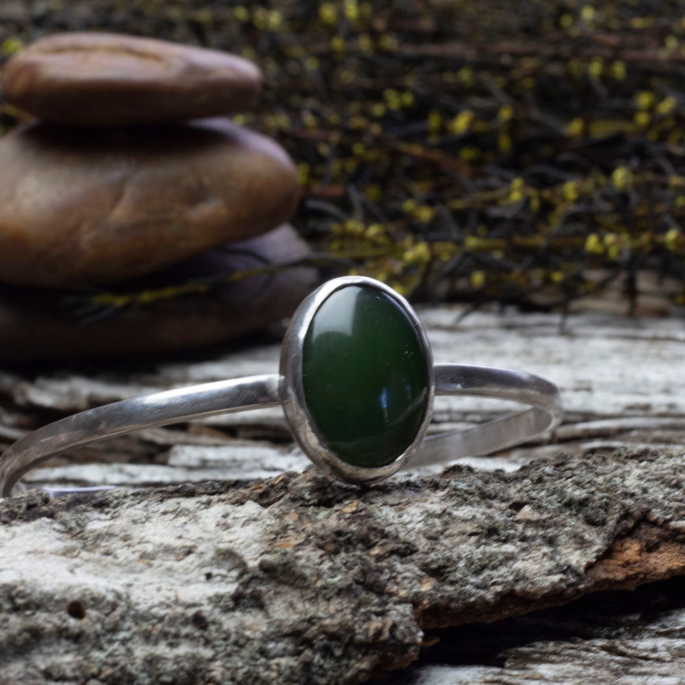 Sterling silver cuff bracelet with medium oval nephrite jade