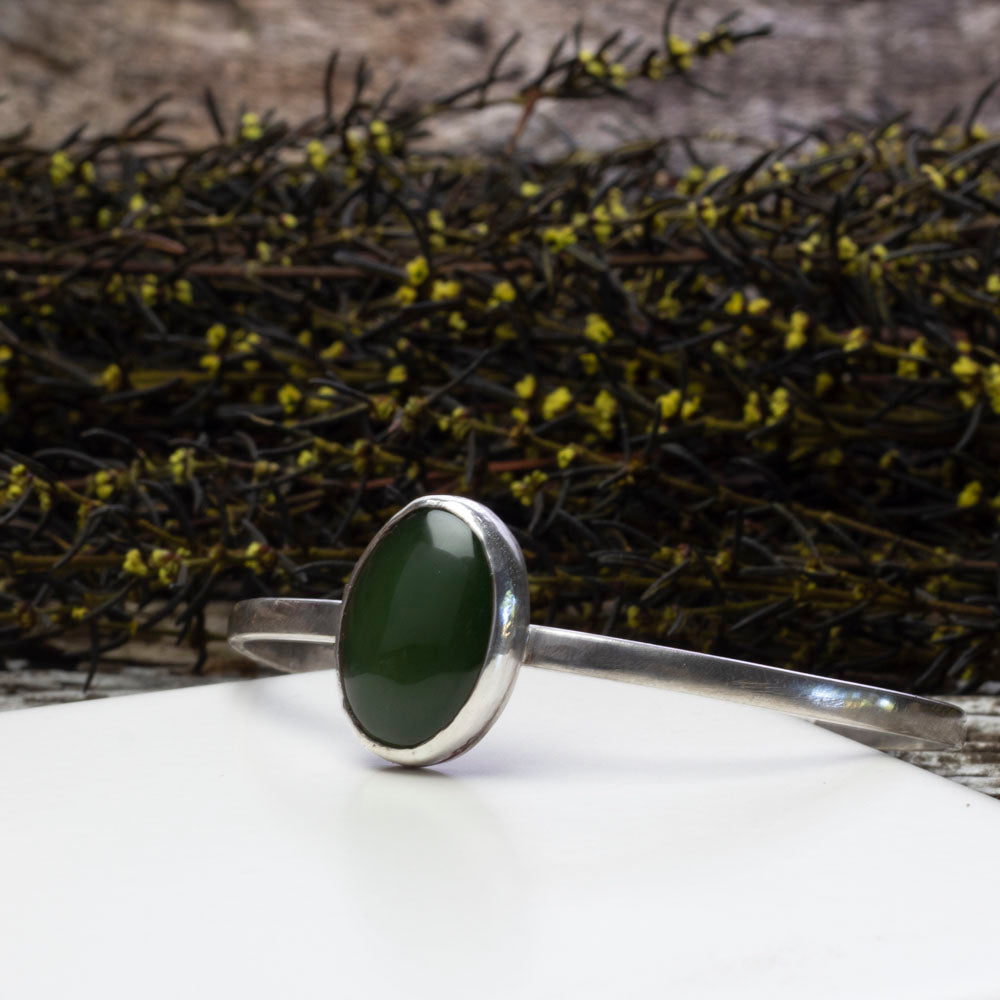 Sterling silver cuff bracelet with medium oval nephrite jade
