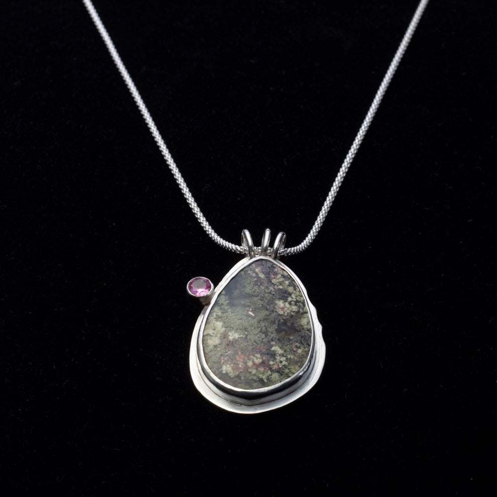 Teardrop dendritic agate pendant with pink tourmaline on sterling silver chain.