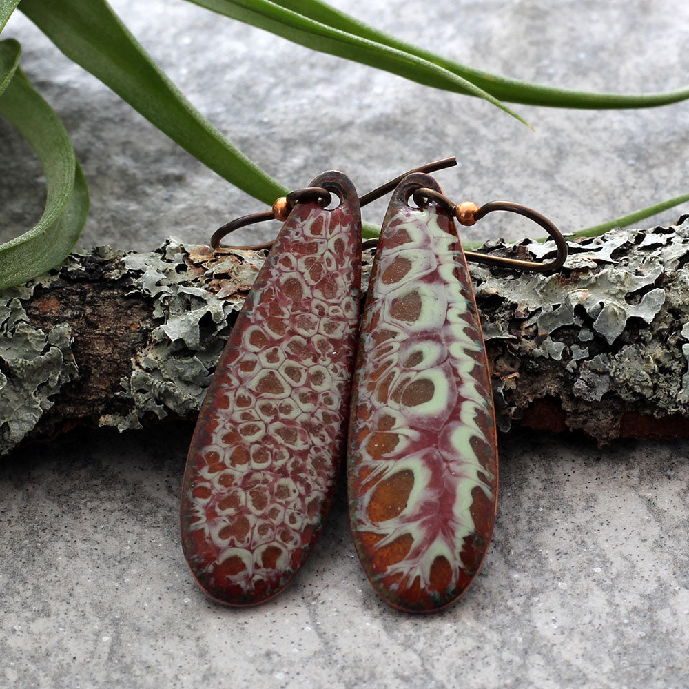 Long oval enamel earrings with green and yellow organic pattern and niobium ear wires