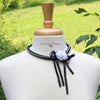 black and white bead crochet necklace with rosette ribbons