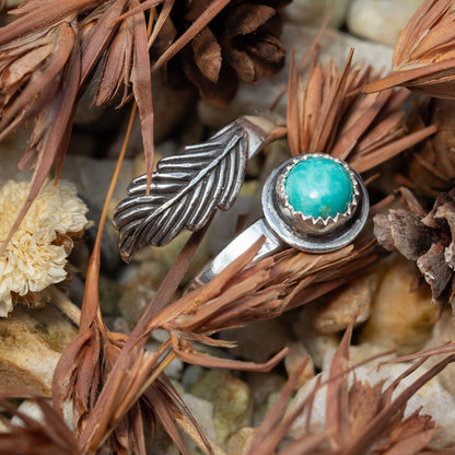 kingman turquoise and Silver ring with turquoise stone on a bed of dried plants and stones