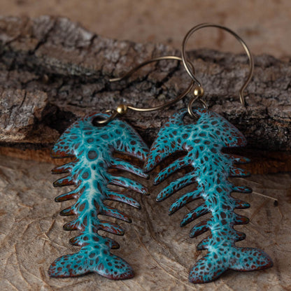 Colorful kiln-fired enamel fishbone earrings on copper with niobium ear wires, handmade by Divella Designs in Vermont.