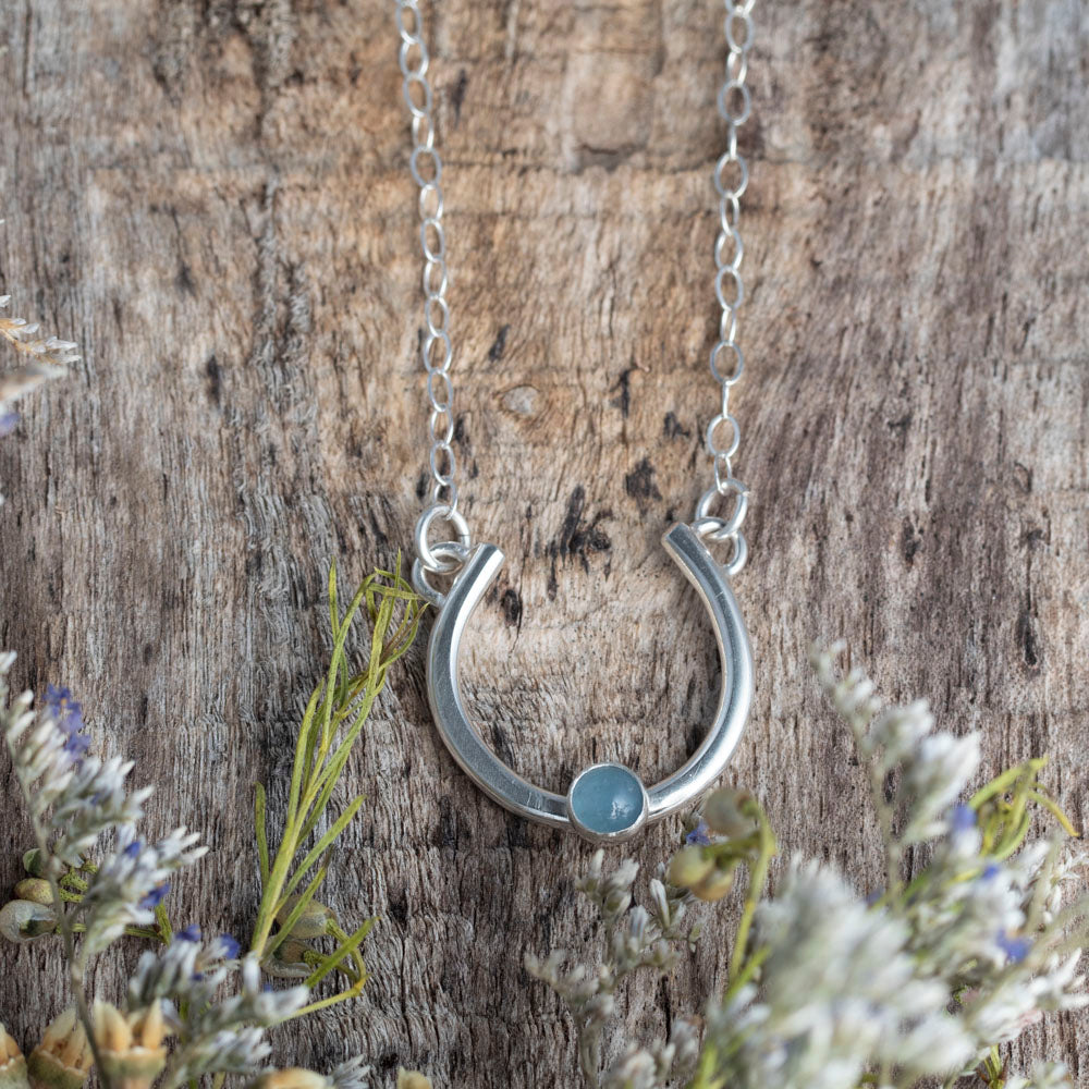 Sterling silver Sky Arc necklace with Aquamarine gemstone on 18 inch chain, handmade in Vermont.