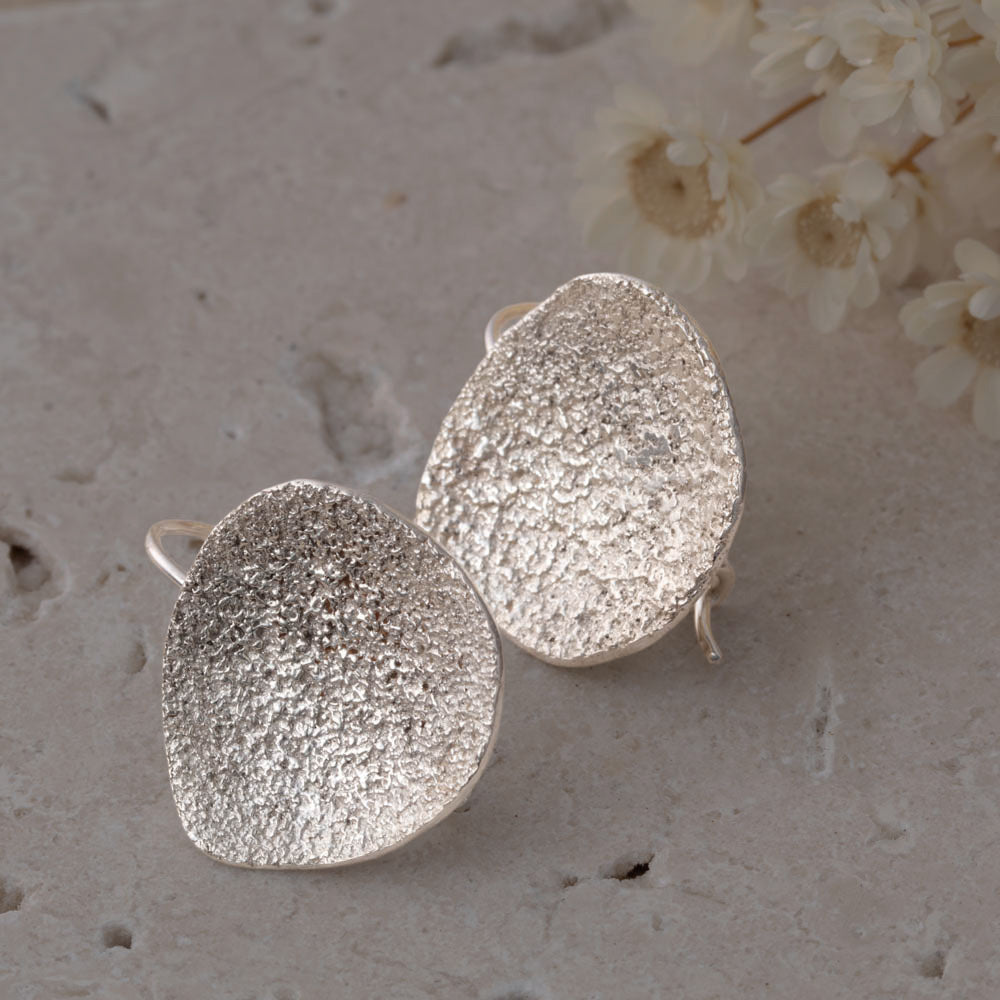 Fused sterling silver asymmetrical earrings with organic handmade texture, crafted in Vermont by Divella Designs.