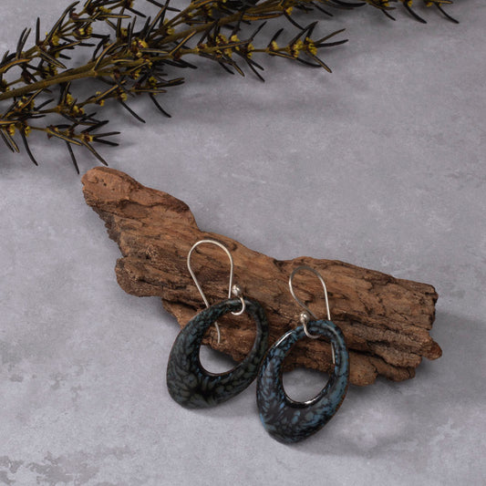 Handmade enamel teardrop dangle earrings in black and gray, nature-inspired jewelry on copper with sterling silver ear wires