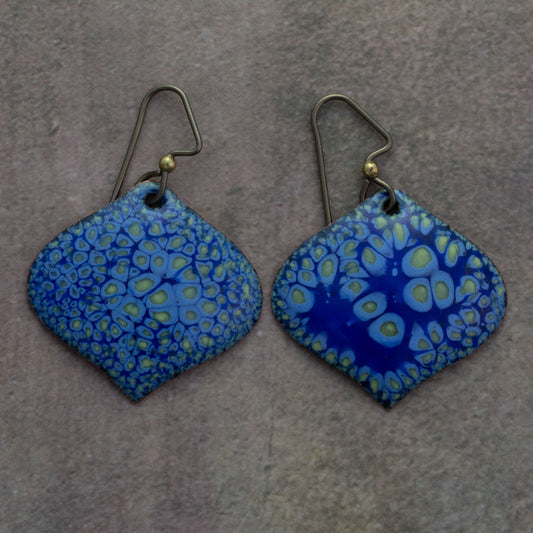 Blue enameled artisan earrings with lime green and aqua organic pattern, handmade curved diamond-shaped Handcrafted spiral enamel earrings in green, yellow, and blue with lichen-inspired texture and hypoallergenic niobium ear wires.