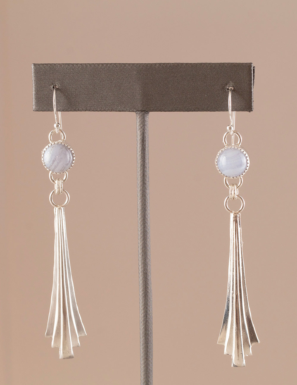 Handmade sterling silver dangle earrings with fan-shaped cascading drops and round blue lace agate gemstones, featuring a modern artisan design with soft pastel tones