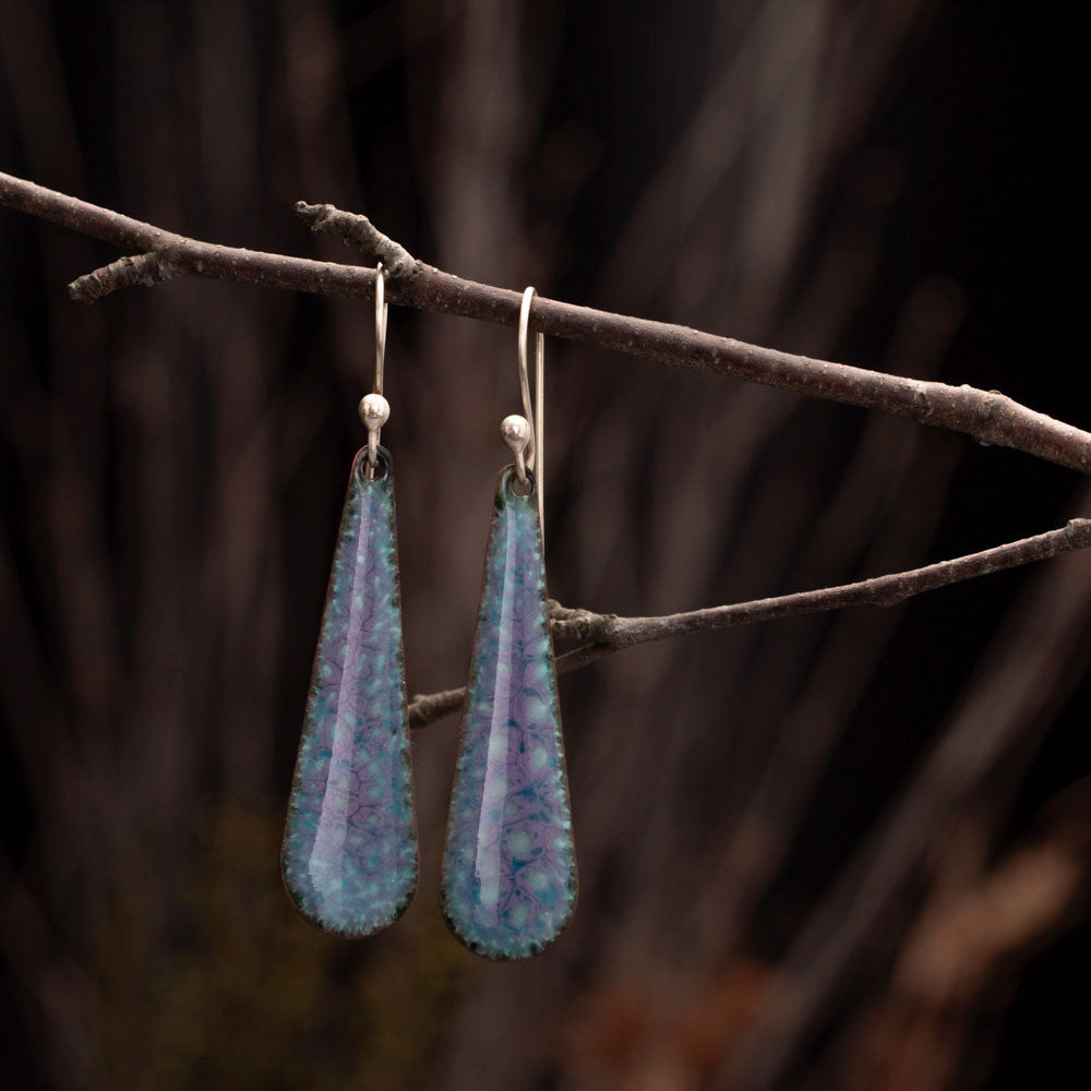 Celestial-inspired handmade enamel teardrop earrings in shades of purple and blue with sterling silver ear wires.