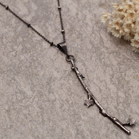Sterling silver branch necklace with maple leaf charms on a beaded 18-inch oxidized chain,