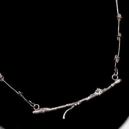 Handmade sterling silver branch necklace with fused textures and custom paddle link chain, woodland nature jewelry