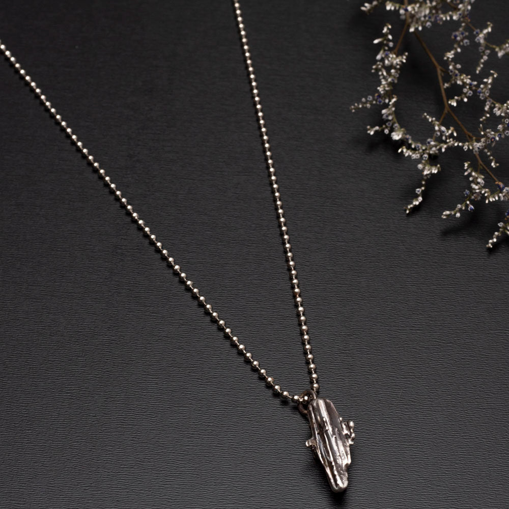 Handmade broom-cast sterling silver necklace created from recycled scrap silver, unique organic pendant on silver chain.