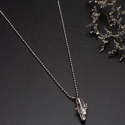 Handmade broom-cast sterling silver necklace created from recycled scrap silver, unique organic pendant on silver chain.