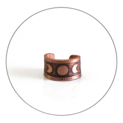 Copper ear cuff with phases of the moon design