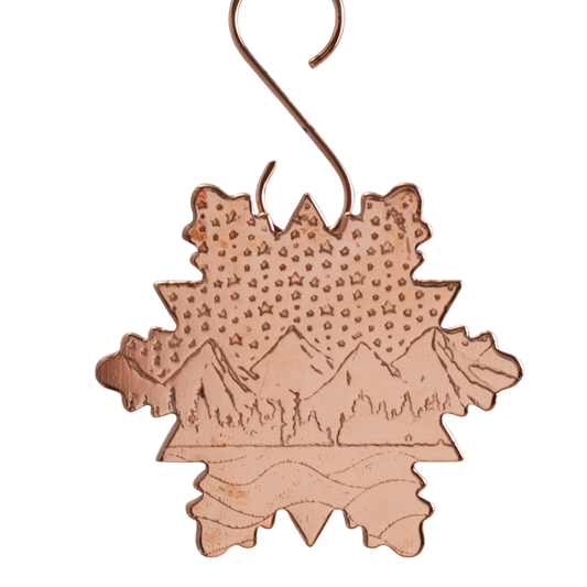 Copper snowflake ornament with mountain and starry sky design, marked as a second due to minor flaw, 3-inch wide (5-inch with hook), handmade in Vermont