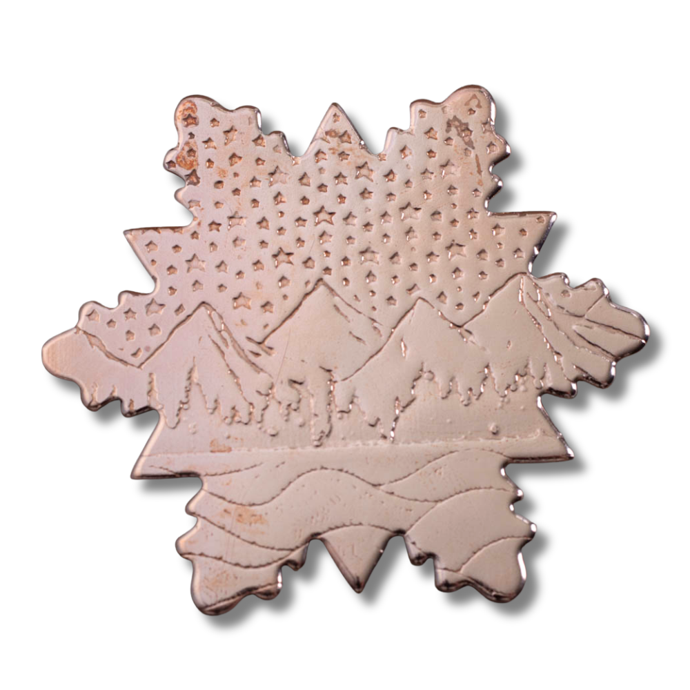 Copper snowflake ornament with mountain and starry sky design, marked as a second due to minor flaw, 3-inch wide (5-inch with hook), handmade in Vermont