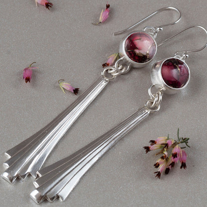 Handmade sterling silver dangle earrings with fan-shaped drops and round red and pink dahlia jasper stones, featuring floral-inspired artisan design and modern elegance.