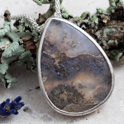 Dendritic agate sterling silver necklace with 1 by 1 2/5 inch pendant and 18 inch chain, handmade by Divella Designs in Vermont.