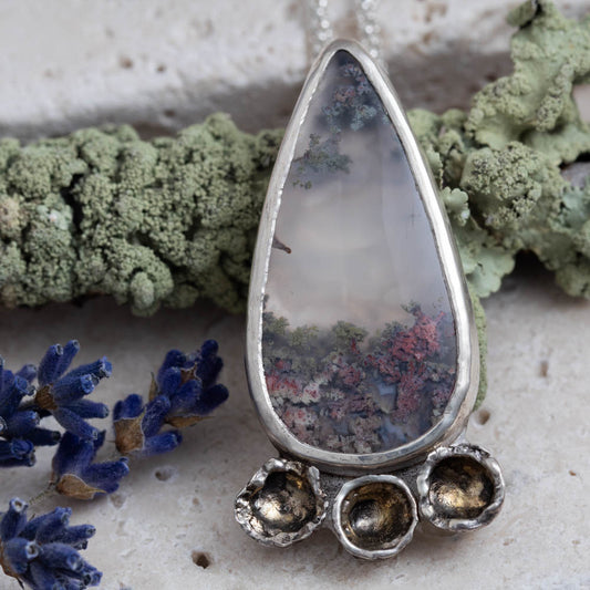Dendritic agate sterling silver necklace with 1/2 by 1 1/2 inch pendant and 18 inch chain, handmade by Divella Designs in Vermont.