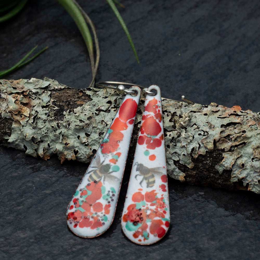 Enamel bee earrings with floral splatter and sterling silver ear wires