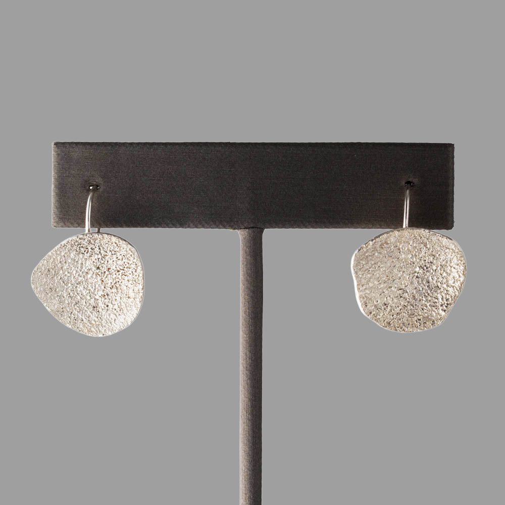 Fused sterling silver asymmetrical earrings with organic handmade texture, crafted in Vermont by Divella Designs.