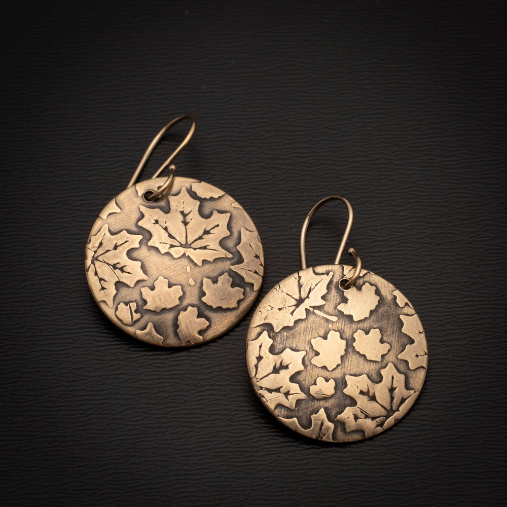 Gold brass maple leaf earrings with textured high-shine finish and 14k gold-filled ear wires, handmade by Divella Designs.