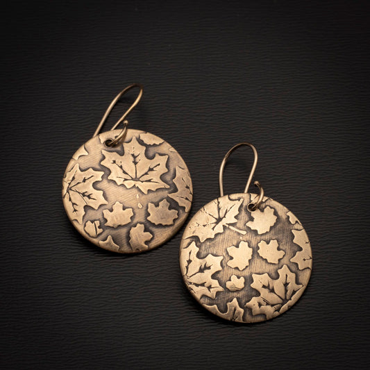 Gold brass maple leaf earrings with textured high-shine finish and 14k gold-filled ear wires, handmade by Divella Designs.