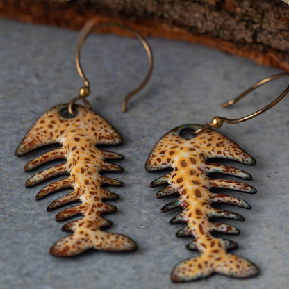 Colorful kiln-fired enamel fishbone earrings on copper with niobium ear wires, handmade by Divella Designs in Vermont.