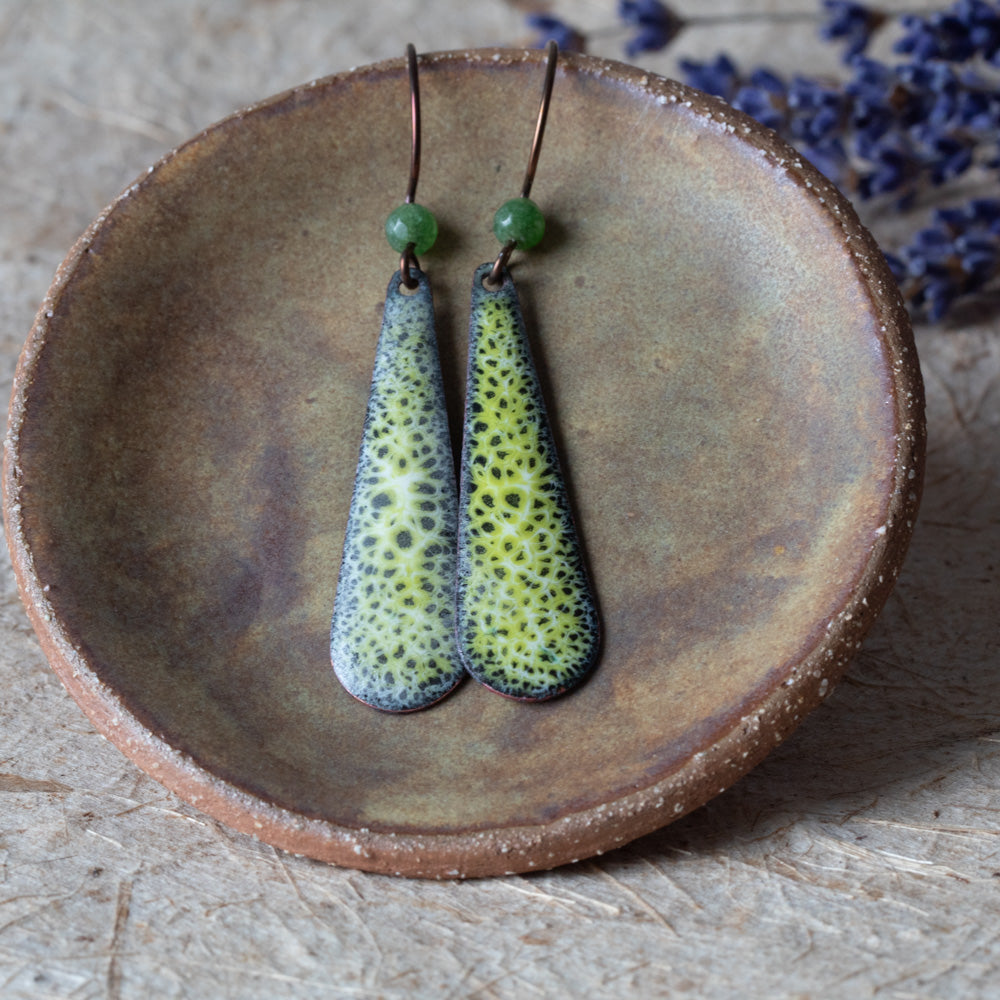 Green enamel teardrop earrings with lacy moss-like pattern, green semi-precious gemstone beads, and niobium ear wires.