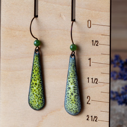 Green enamel teardrop earrings with lacy moss-like pattern, green semi-precious gemstone beads, and niobium ear wires.