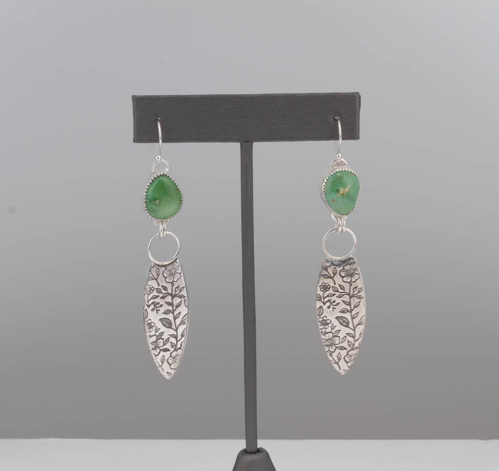 Green turquoise earrings with fine silver bezel and botanical sterling drop on ruler display