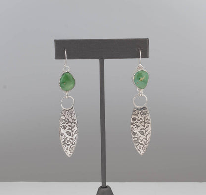 Green turquoise earrings with fine silver bezel and botanical sterling drop on ruler display