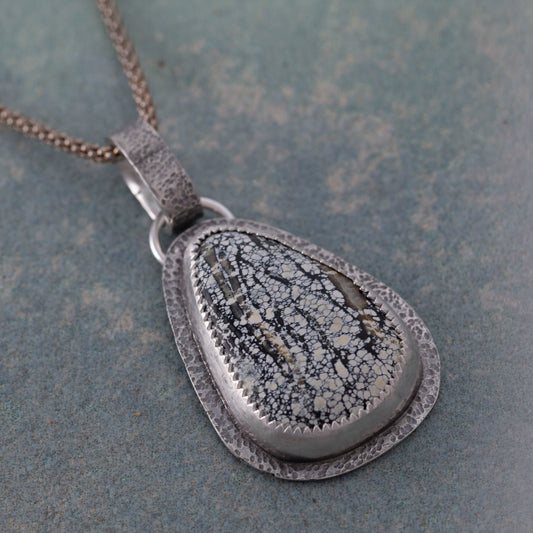 Handmade sterling silver Ivory Creek Variscite necklace with textured silver backplate and bail. Nature-inspired pendant on an 18" sterling silver popcorn chain.