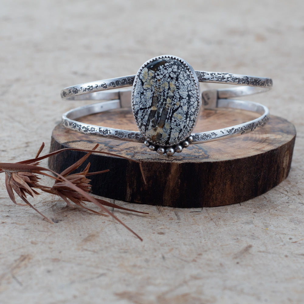Sterling silver cuff bracelet with textured double bands and an oval Ivory Creek Variscite stone set in silver.