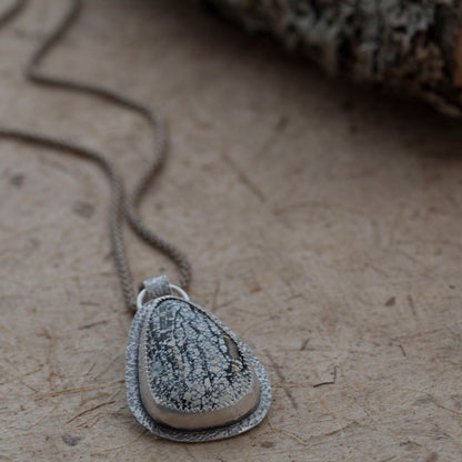 Handmade sterling silver Ivory Creek Variscite necklace with textured silver backplate and bail. Nature-inspired pendant on an 18" sterling silver popcorn chain.