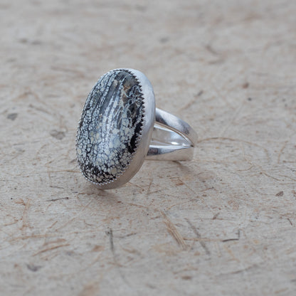 Silver ring with an Ivory Creek Variscite  stone on a textured beige surface
